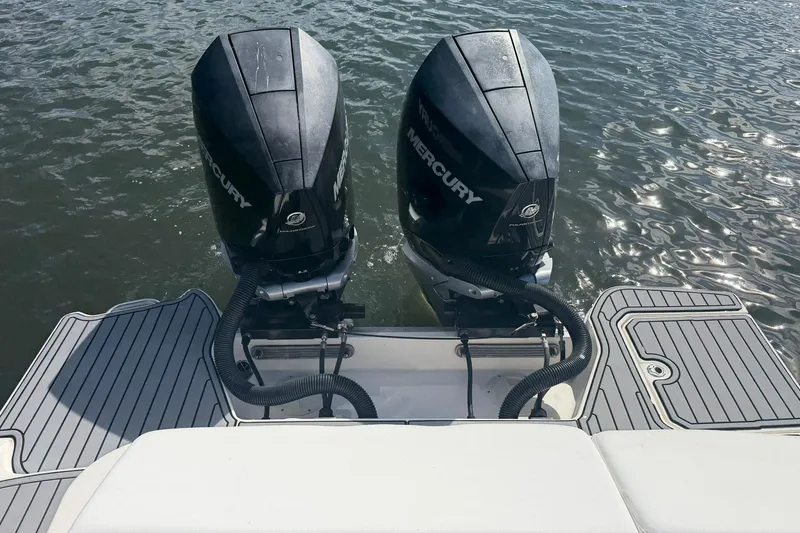 Slide: The Image of 2020 Sea Ray SDX 290 Outboard with twin Mercury engines on water. - 7