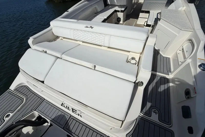 Slide: The Image of 2020 Sea Ray SDX 290 Outboard boat interior with white seating and deck. - 9