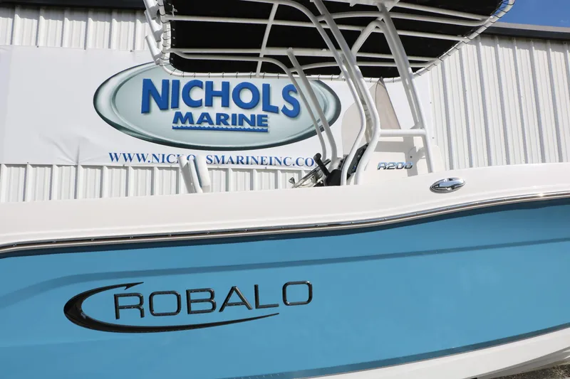 Slide: The Image of 2026 Robalo R200 Center Console boat at Nichols Marine dealership. - 13