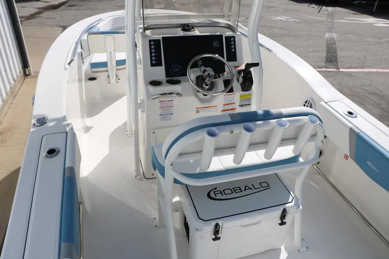 Slide: The Image of 2026 Robalo R200 Center Console boat interior with steering wheel and seating. - 17