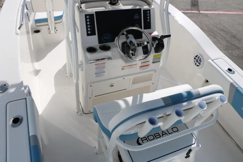 Slide: The Image of 2026 Robalo R200 Center Console boat interior with steering wheel and seating. - 19