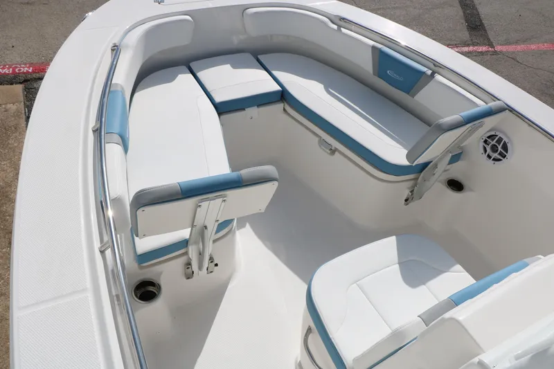Slide: The Image of 2026 Robalo R200 Center Console boat interior with white and blue seating. - 20