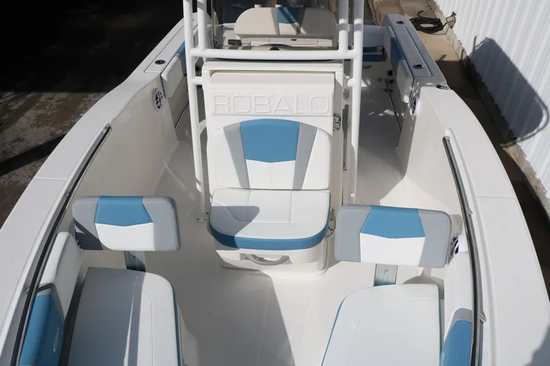 Slide: The Image of 2026 Robalo R200 Center Console boat interior with blue and white seating. - 21
