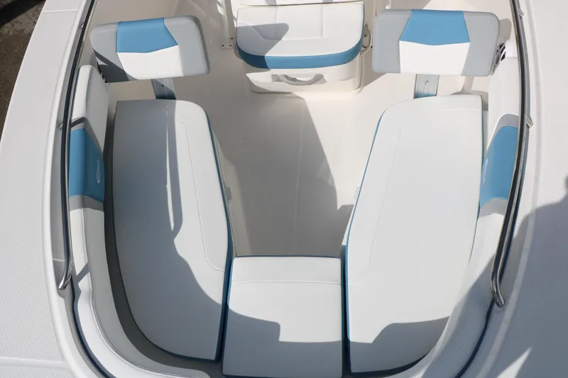 Slide: The Image of 2026 Robalo R200 Center Console boat interior with white and blue seating. - 22