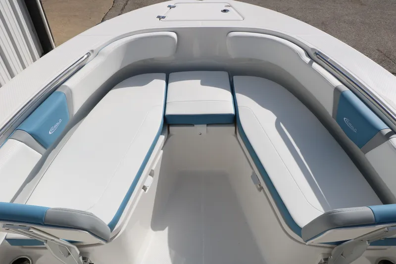 Slide: The Image of 2026 Robalo R200 Center Console boat interior with white and blue cushioned seating. - 23