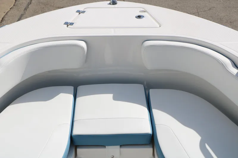 Slide: The Image of 2026 Robalo R200 Center Console boat with white cushioned seating area. - 24