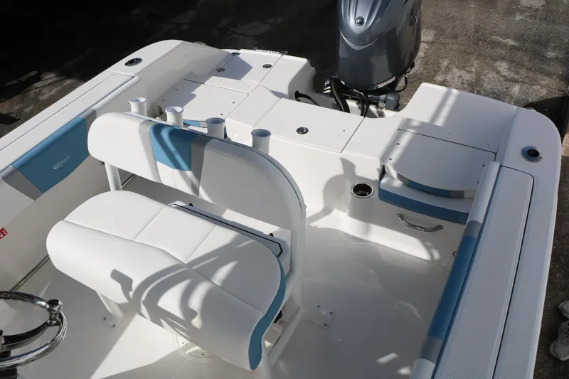 Slide: The Image of 2026 Robalo R200 Center Console boat interior with seating and motor. - 26