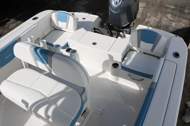 Slide: The Image of 2026 Robalo R200 Center Console boat interior with white and blue seating. - 27