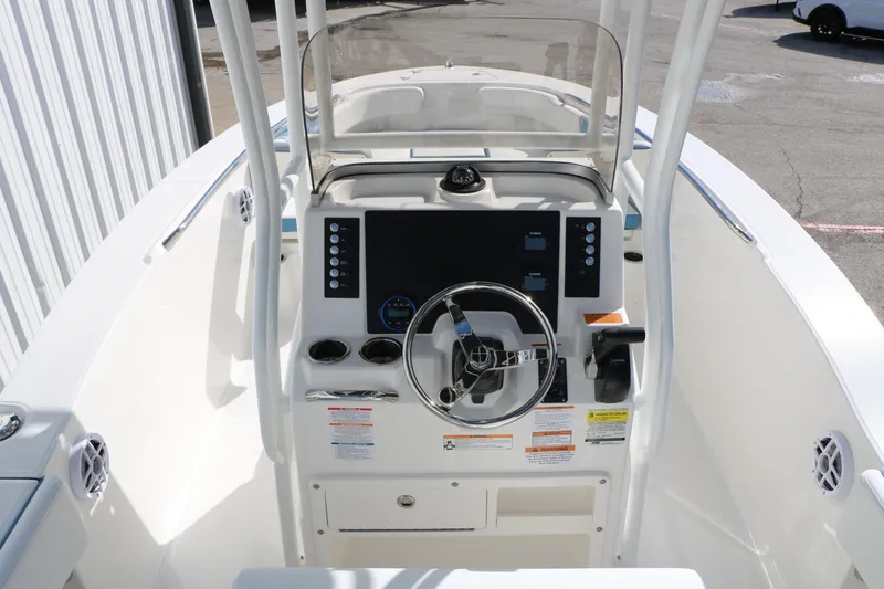 Slide: The Image of 2026 Robalo R200 Center Console boat interior with steering wheel and control panel. - 29