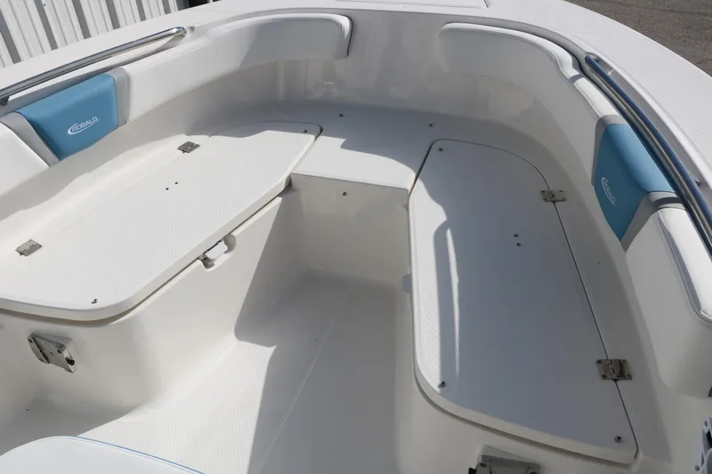 Slide: The Image of 2026 Robalo R200 Center Console boat interior with white seating and storage compartments. - 32