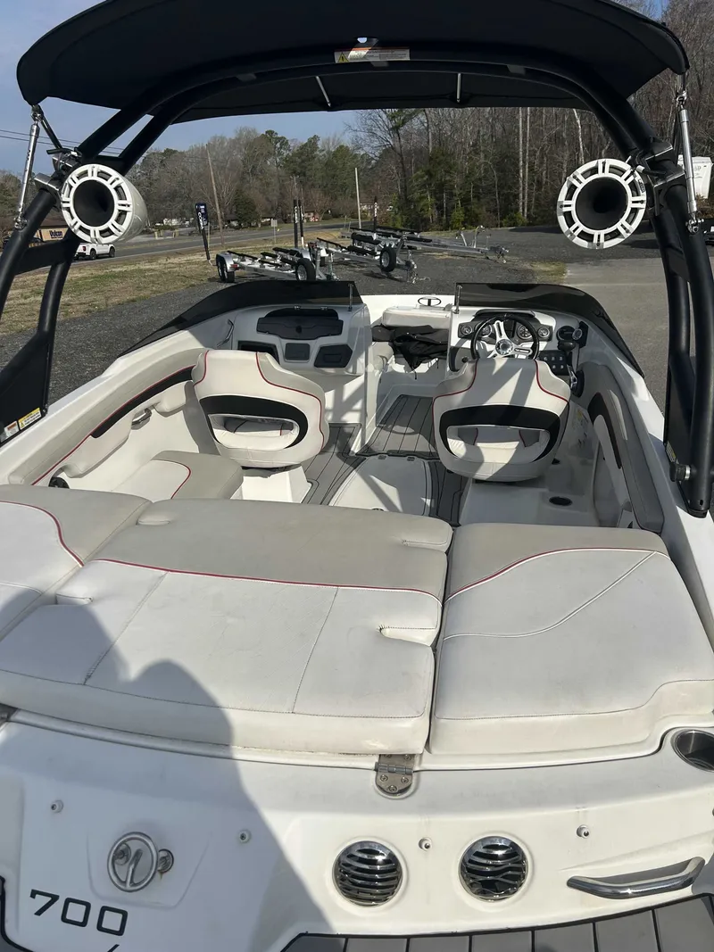 Slide: The Image of Interior of a 2019 Tahoe 700 Limited boat with white seating. - 4