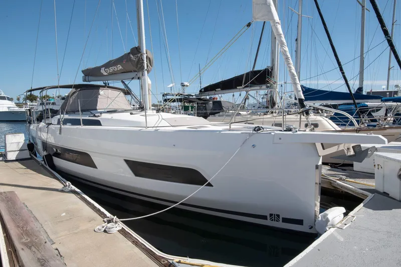 The Image of 2024 Dufour 41 sailboat docked at marina, showcasing sleek design and modern features. - 0