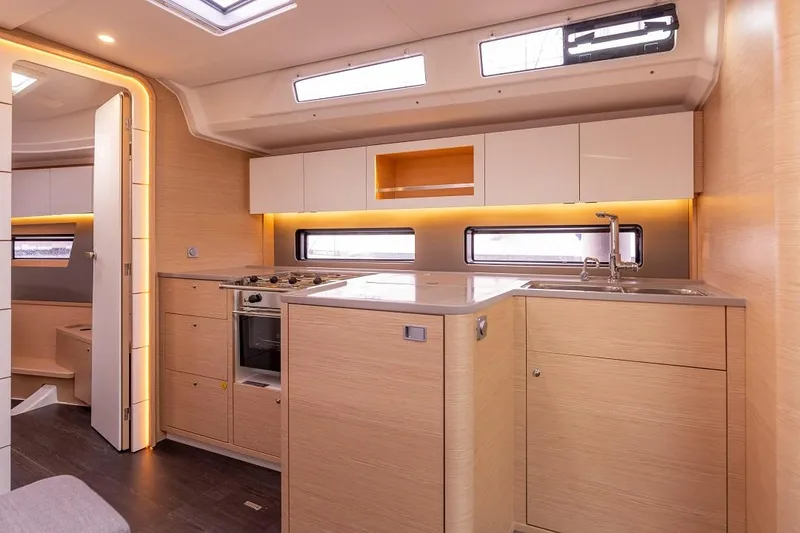 Slide: The Image of Modern kitchen interior of 2024 Dufour 41 yacht with sleek cabinetry and ample lighting. - 13