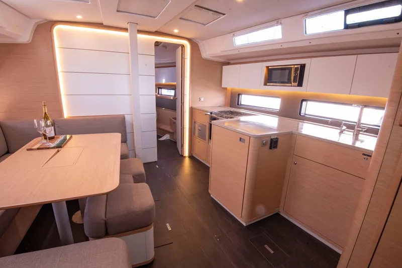 Slide: The Image of Luxurious interior of 2024 Dufour 41 yacht with modern kitchen and dining area. - 18