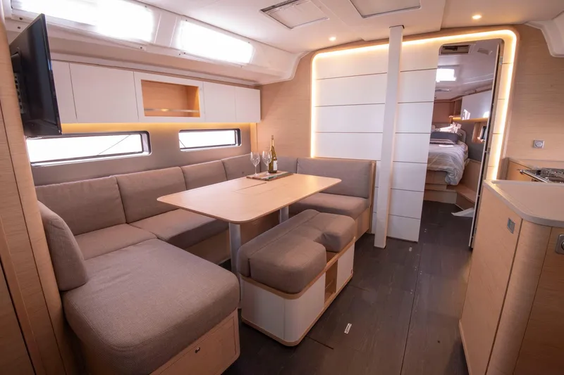 Slide: The Image of Luxurious interior of 2024 Dufour 41 yacht with modern seating and dining area. - 19
