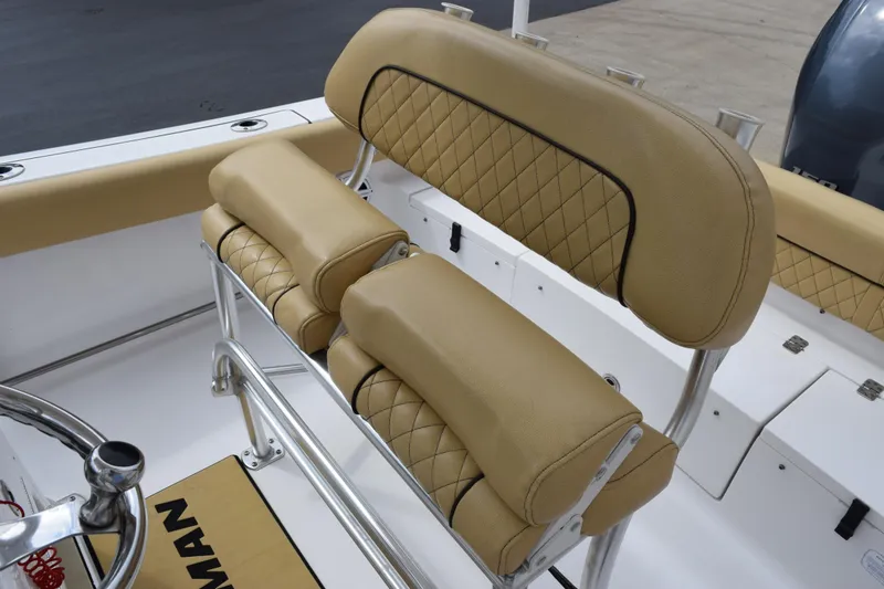 Slide: The Image of 2019 Sportsman Heritage 211 Center Console boat with tan cushioned seating and stainless steel frame. - 10