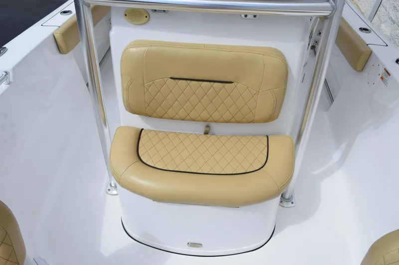 Slide: The Image of 2019 Sportsman Heritage 211 Center Console boat with tan cushioned seating. - 13