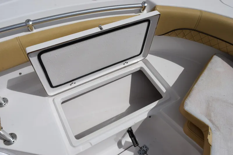 Slide: The Image of Open storage compartment on 2019 Sportsman Heritage 211 Center Console boat. - 17