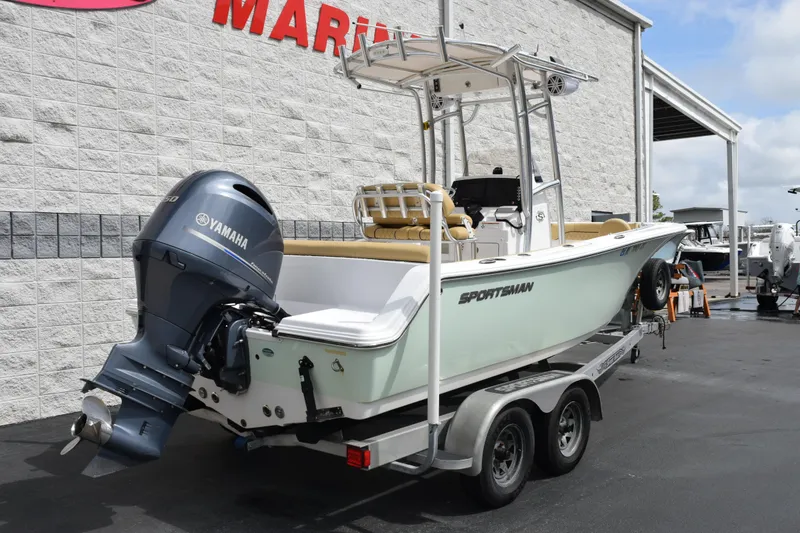 Slide: The Image of 2019 Sportsman Heritage 211 Center Console boat on trailer, featuring Yamaha outboard motor. - 4