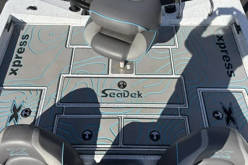 Slide: The Image of 2022 Xpress X19 Pro boat interior with SeaDek flooring and seating. - 21
