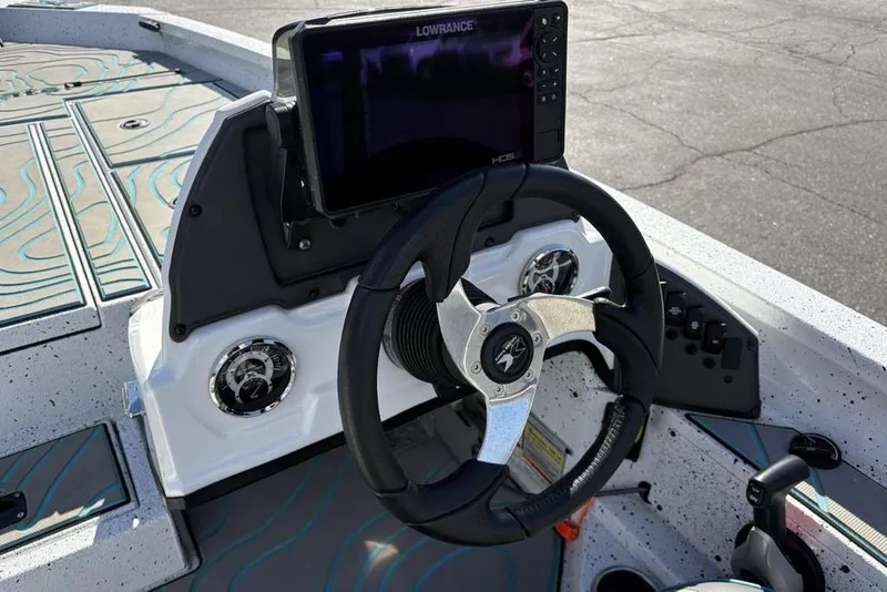 Slide: The Image of Steering console of 2022 Xpress X19 Pro boat with Lowrance display and modern controls. - 22