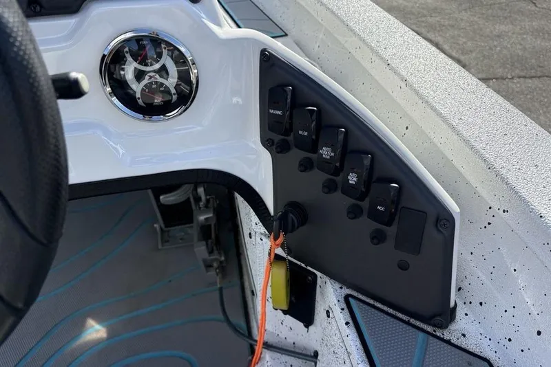 Slide: The Image of Dashboard of 2022 Xpress X19 Pro boat with gauges and control switches. - 23