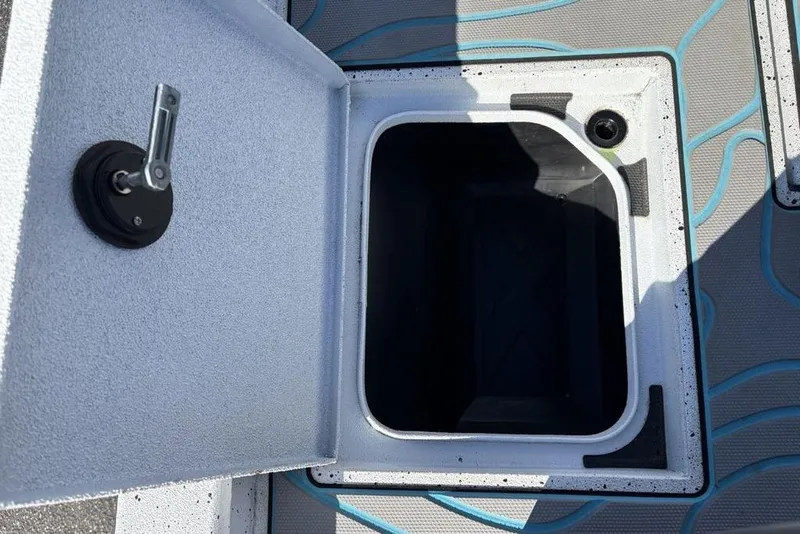 Slide: The Image of Open storage compartment on 2022 Xpress X19 Pro boat deck. - 27