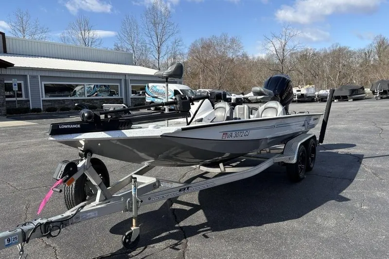 Slide: The Image of 2022 Xpress X19 Pro boat on trailer, parked outdoors near dealership. - 3