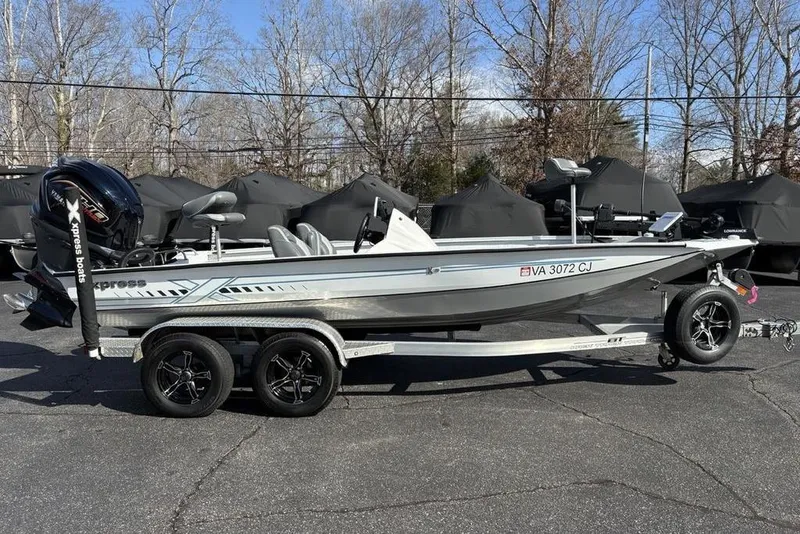 Slide: The Image of 2022 Xpress X19 Pro boat on trailer, parked outdoors, showcasing sleek design and modern features. - 4