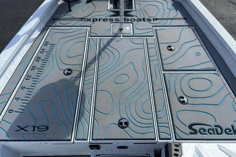 Slide: The Image of 2022 Xpress X19 Pro boat deck with SeaDek flooring and measurement scale. - 8