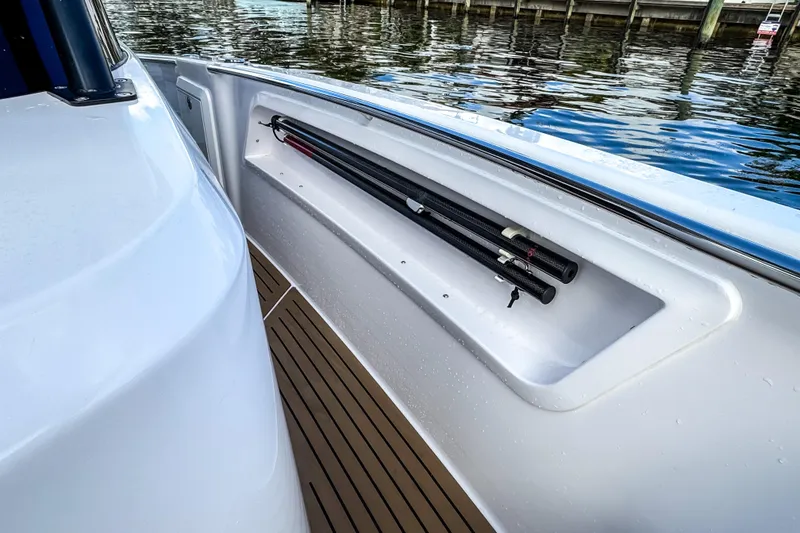 Slide: The Image of STERK 31 boat 2025 with fishing rod holder by the water. - 22