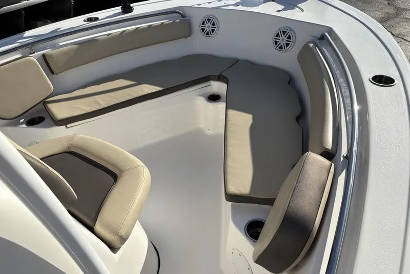 Slide: The Image of 2018 Tidewater 210 LXF boat interior with cushioned seating and cup holders. - 12