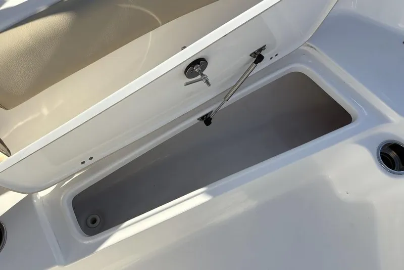 Slide: The Image of Open storage compartment on a 2018 Tidewater 210 LXF boat. - 14