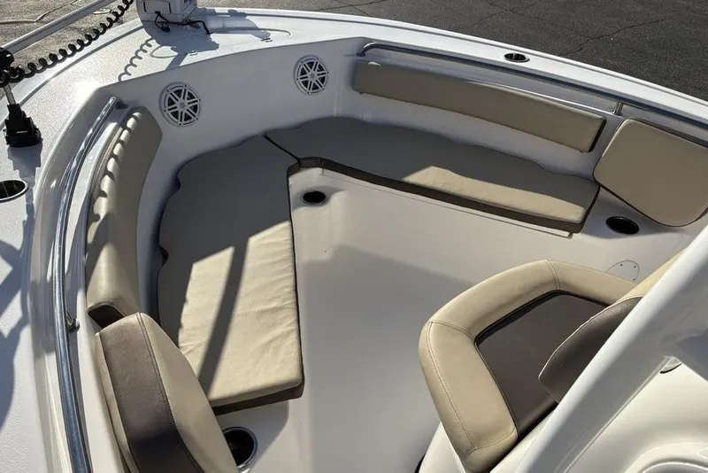 Slide: The Image of 2018 Tidewater 210 LXF boat interior with cushioned seating and cup holders. - 15