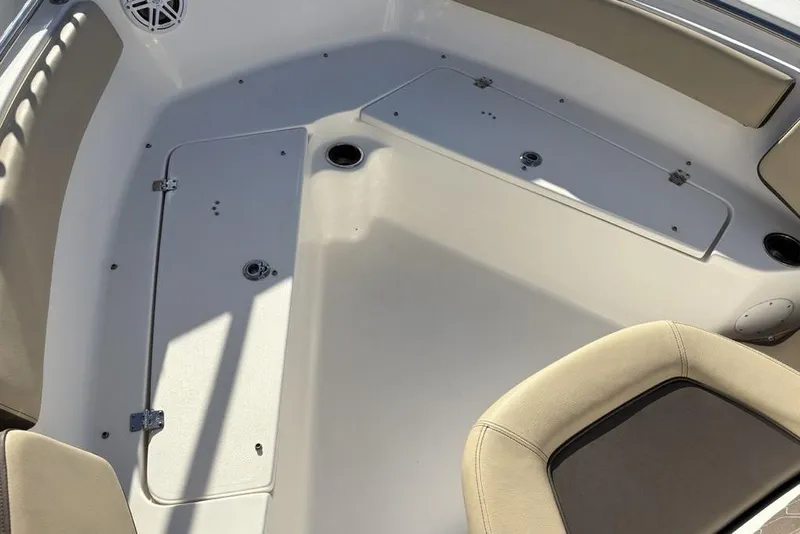 Slide: The Image of Interior view of 2018 Tidewater 210 LXF boat, featuring seating and storage compartments. - 17