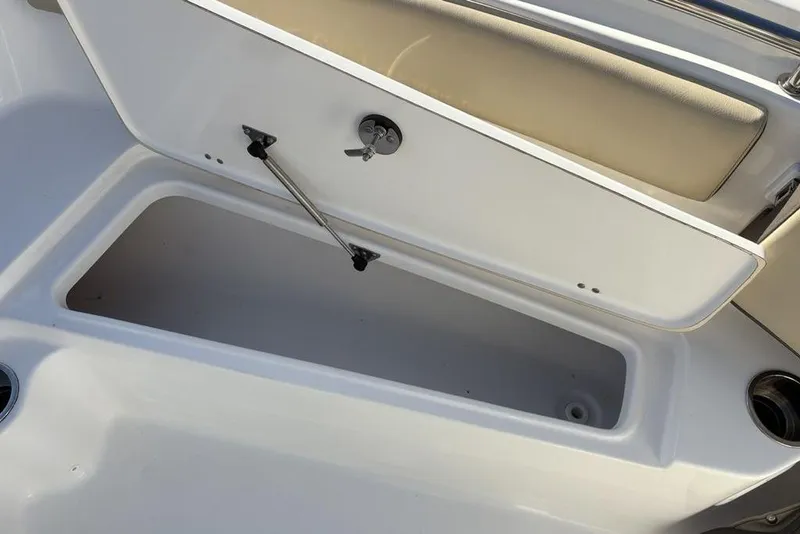 Slide: The Image of Open storage compartment on a 2018 Tidewater 210 LXF boat. - 23