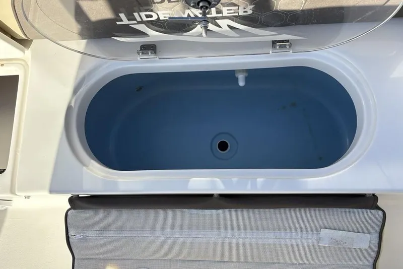 Slide: The Image of Tidewater 210 LXF 2018 boat hatch with open lid. - 24