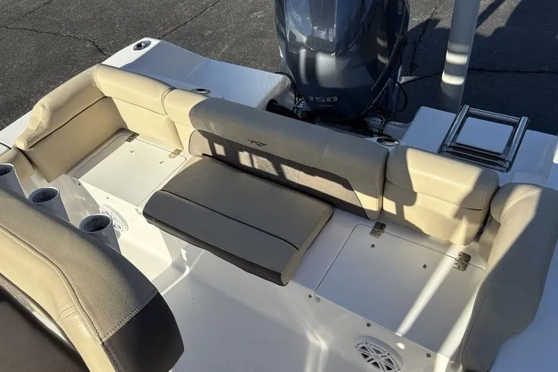 Slide: The Image of 2018 Tidewater 210 LXF boat interior with beige seating and Yamaha 150 engine. - 25