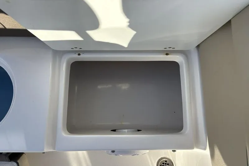 Slide: The Image of Open storage compartment on a 2018 Tidewater 210 LXF boat. - 27