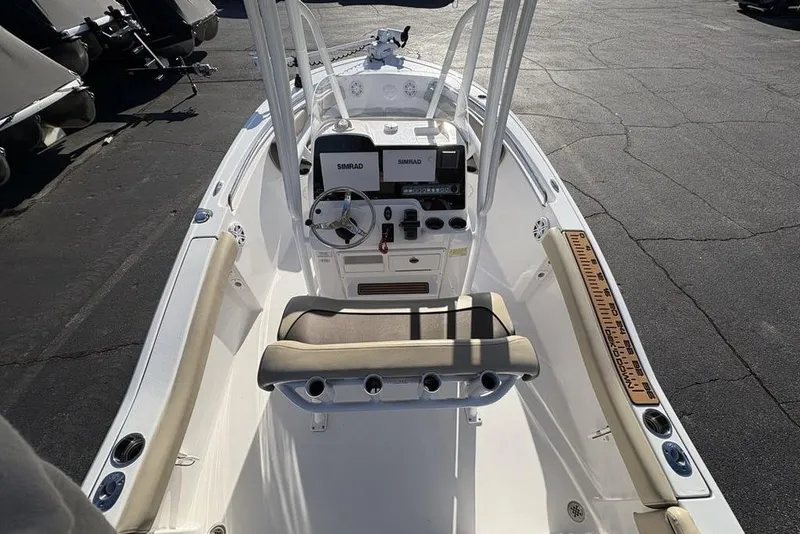 Slide: The Image of Interior view of a 2018 Tidewater 210 LXF boat with helm console. - 28