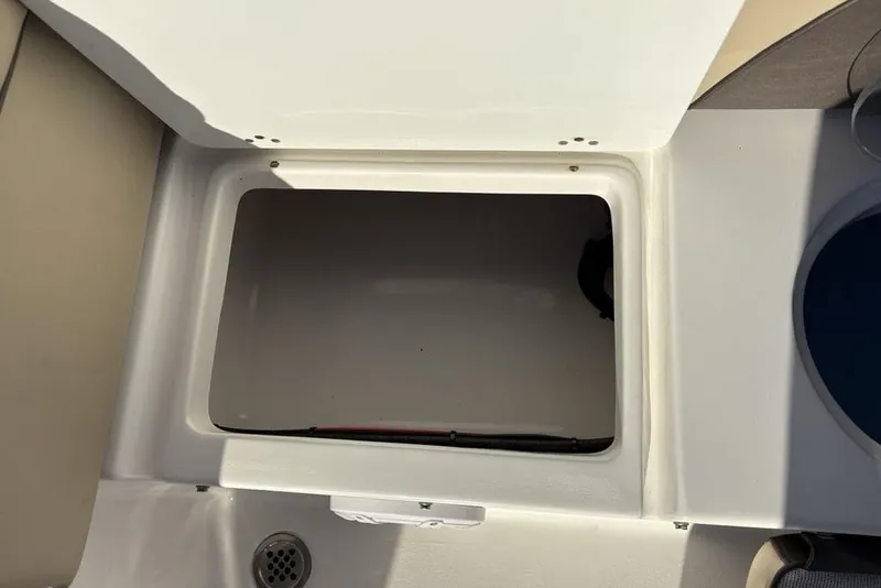 Slide: The Image of Open storage compartment in 2018 Tidewater 210 LXF boat. - 30