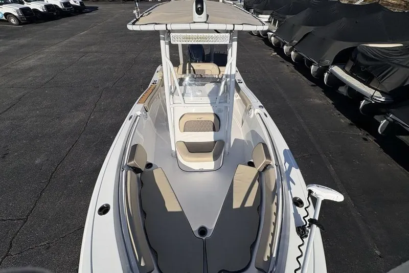 Slide: The Image of 2018 Tidewater 210 LXF boat on a parking lot. - 31