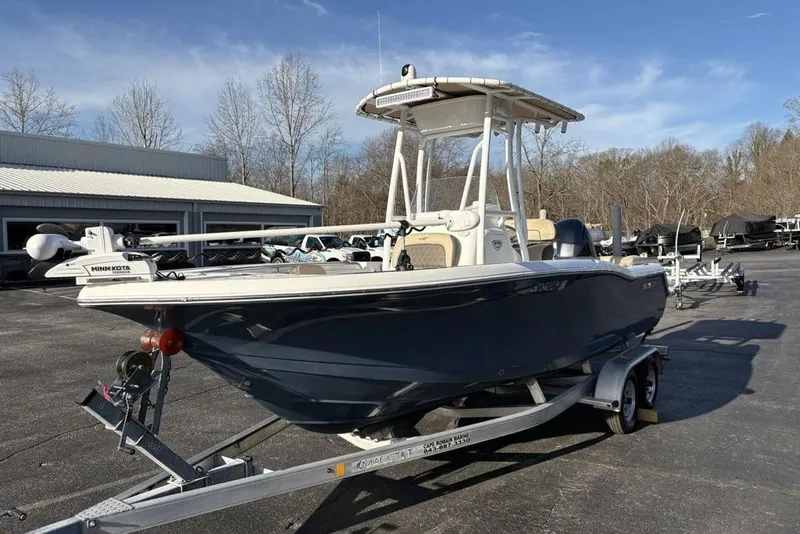 Slide: The Image of 2018 Tidewater 210 LXF boat on trailer in outdoor lot. - 4