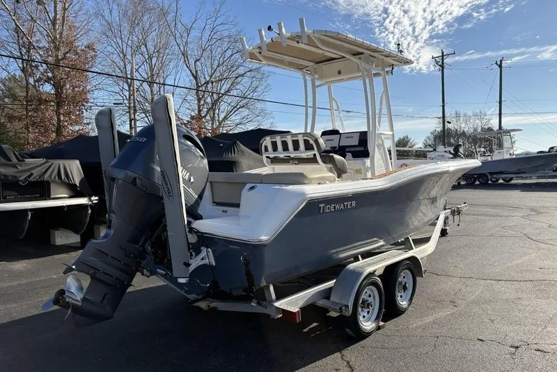 Slide: The Image of 2018 Tidewater 210 LXF boat on trailer, featuring Yamaha outboard motor. - 9