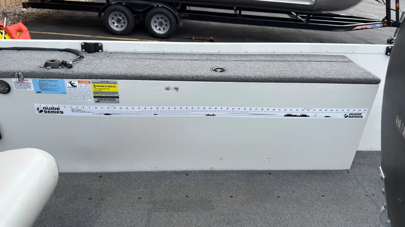 Slide: The Image of 2003 Alumacraft Lunker 165 LTD boat with measuring tape and capacity labels. - 10