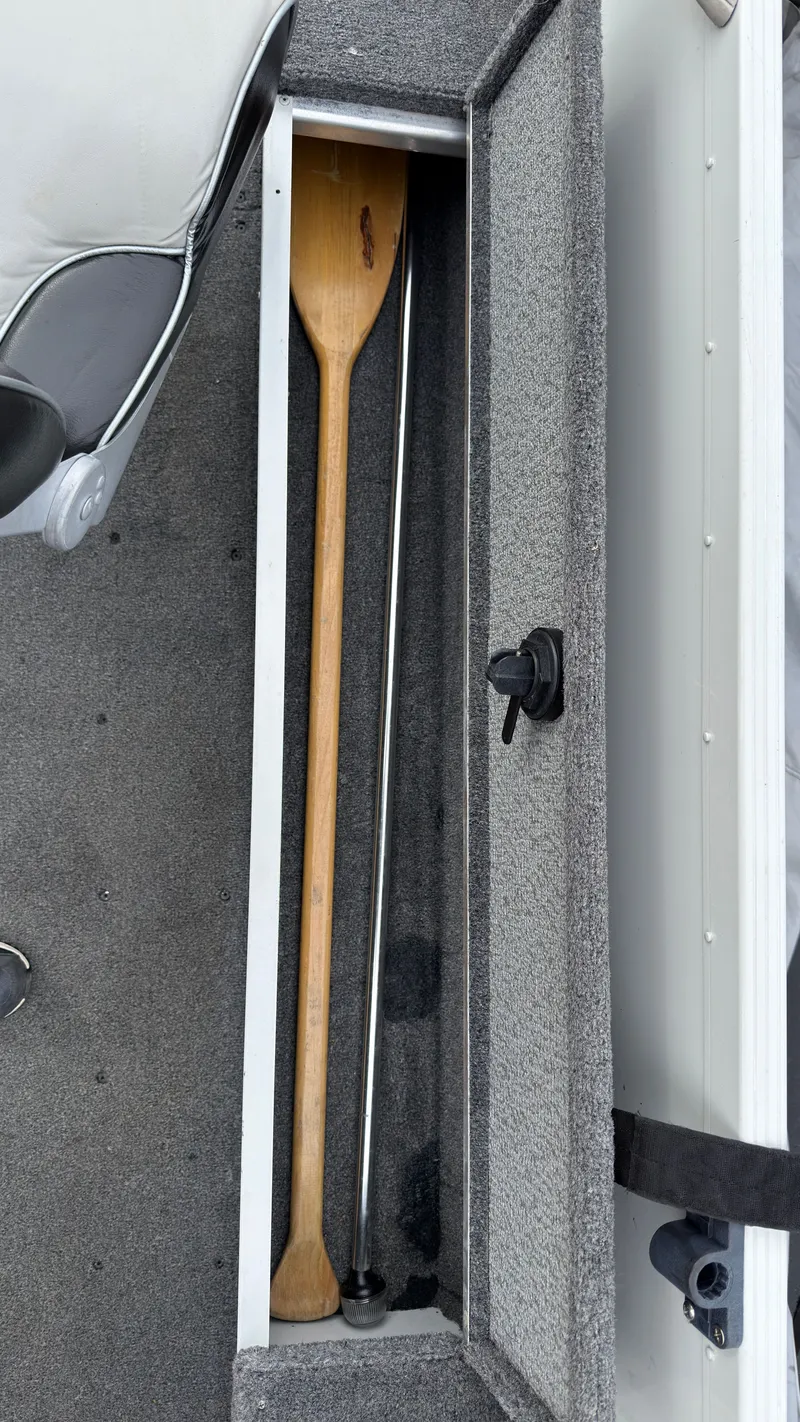 Slide: The Image of Interior of a 2003 Alumacraft Lunker 165 LTD boat with paddle. - 12