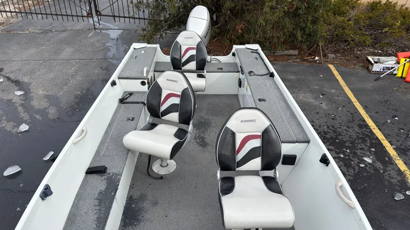Slide: The Image of Interior view of a 2003 Alumacraft Lunker 165 LTD boat with seating. - 17