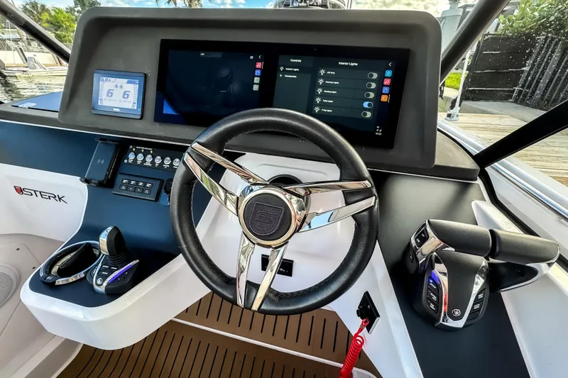 Slide: The Image of STERK 31 boat dashboard, 2025 model, featuring modern controls. - 15