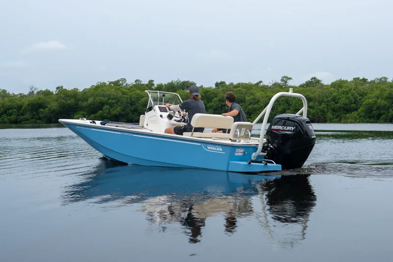 Slide: The Image of Boston Whaler 170 Montauk 2026 on calm water with two people. - 1