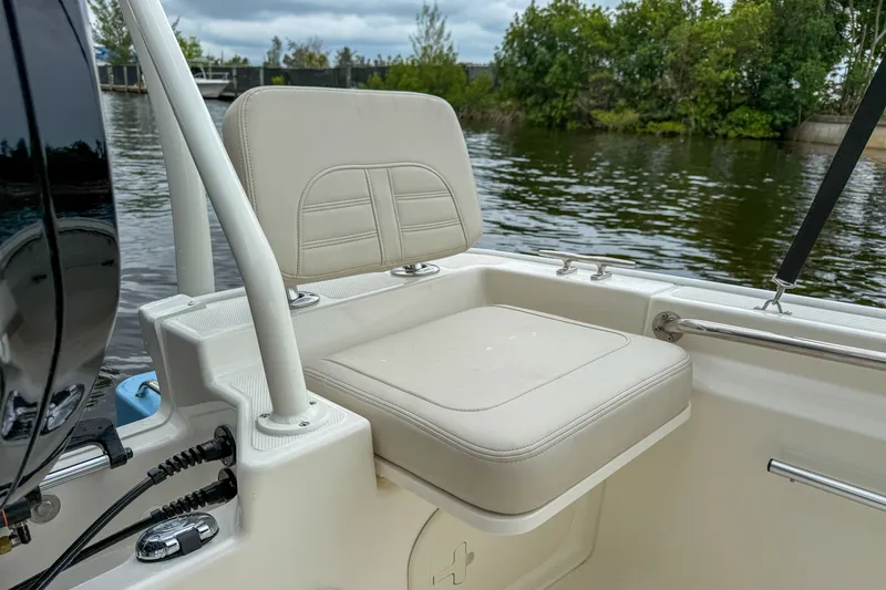 Slide: The Image of Boston Whaler 170 Montauk 2026 seat by the water. - 6